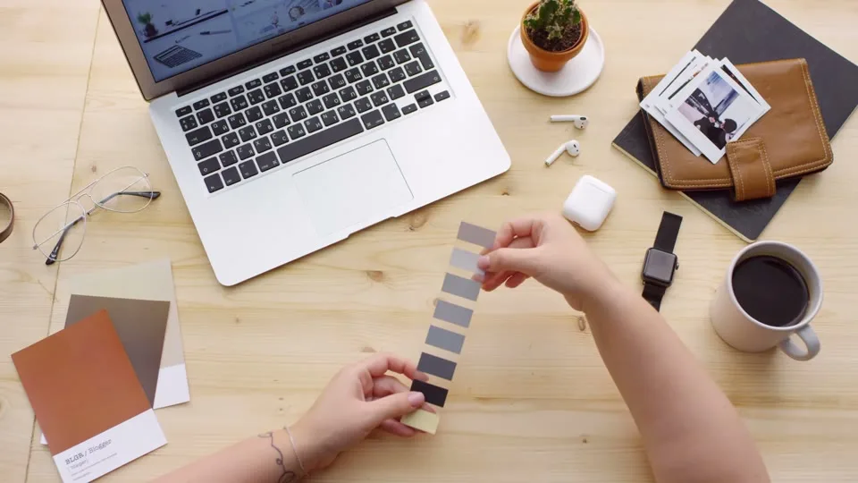 Designer working with brand color swatches